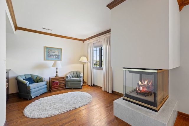 10 Shoreside Dr, South Barrington, IL 60010 - living room featuring ornamental molding, wood finished floors, and a multi sided fireplace