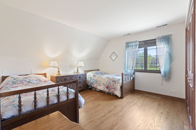 10 Shoreside Dr, South Barrington, IL 60010 - bedroom featuring wood finished floors and lofted ceiling