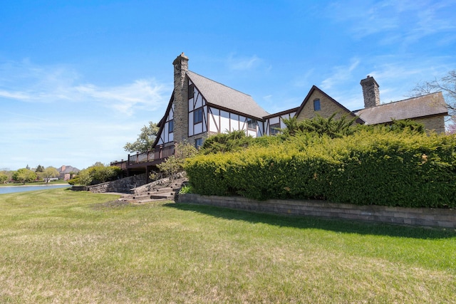 10 Shoreside Dr, South Barrington, IL 60010 - view of property exterior with a yard, a chimney, and a deck with water view