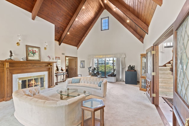 10 Shoreside Dr, South Barrington, IL 60010 - living room with a wood ceiling with exposed beams, high vaulted ceiling, light colored carpet, a glass covered fireplace, and stairway