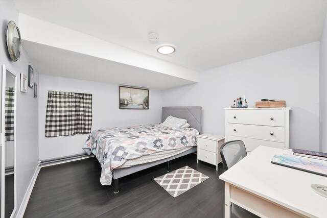 3115 N Marmora Ave, Chicago, IL 60634 - bedroom featuring dark wood-style flooring and baseboards