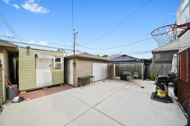 3115 N Marmora Ave, Chicago, IL 60634 - view of patio featuring an outdoor structure, a gazebo, a detached garage, and cooling unit