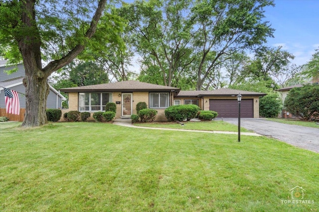 1108 N Westgate Rd, Mount Prospect, IL 60056 - view of front facade with an attached garage, driveway, a front yard, and brick siding