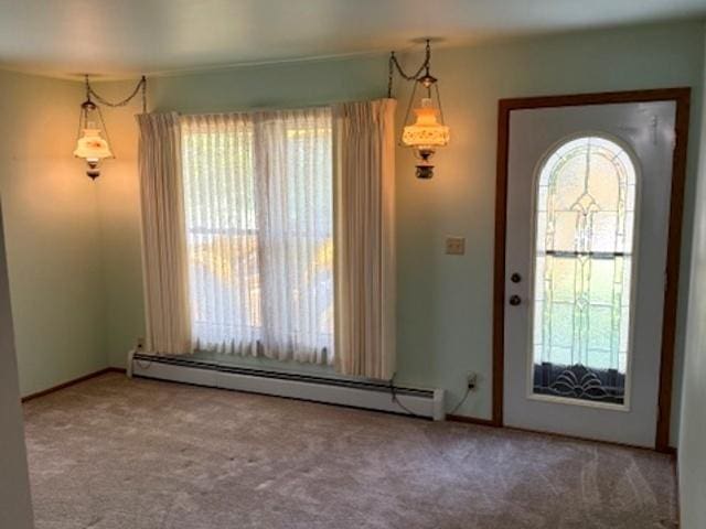 12238 Lisbon Rd, Newark, IL 60541 - carpeted entrance foyer featuring a baseboard radiator and baseboards