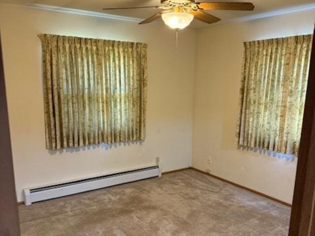 12238 Lisbon Rd, Newark, IL 60541 - carpeted empty room with a baseboard heating unit, a ceiling fan, and ornamental molding