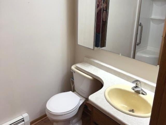 12238 Lisbon Rd, Newark, IL 60541 - full bathroom featuring a baseboard radiator, vanity, and a shower