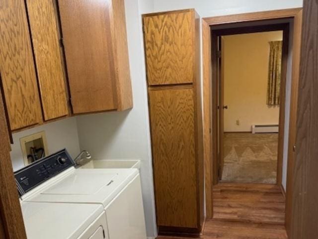 12238 Lisbon Rd, Newark, IL 60541 - laundry room with baseboard heating, cabinet space, wood finished floors, and washing machine and dryer