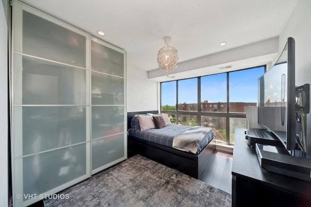 3700 Capri Ct Unit 607, Glenview, IL 60025 - bedroom featuring wood finished floors, recessed lighting, and a chandelier