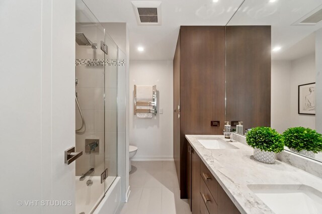3700 Capri Ct Unit 607, Glenview, IL 60025 - bathroom featuring double vanity, bath / shower combo with glass door, recessed lighting, and tile patterned floors