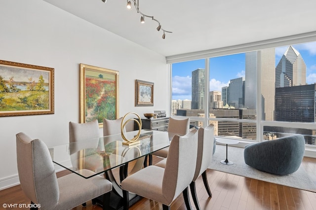 401 N Wabash Ave Unit 32J, Chicago, IL 60611 - kitchen with extractor fan, appliances with stainless steel finishes, light wood finished floors, backsplash, and dark stone countertops