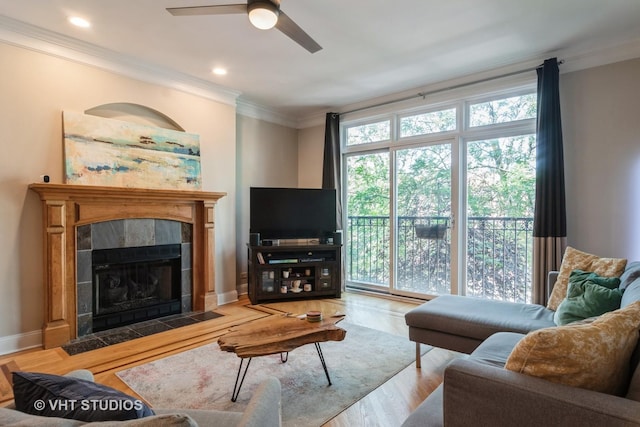 4933 N Winthrop Ave Unit 2S, Chicago, IL 60640 - living area with crown molding, ceiling fan, a tile fireplace, wood finished floors, and recessed lighting