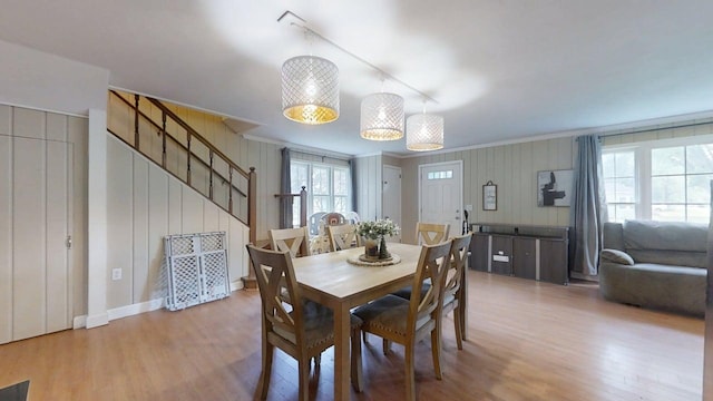 16 W George St, Sullivan, IL 61951 - dining space featuring ornamental molding, wood finished floors, and stairs