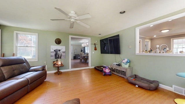 16 W George St, Sullivan, IL 61951 - living area with wood finished floors and ceiling fan