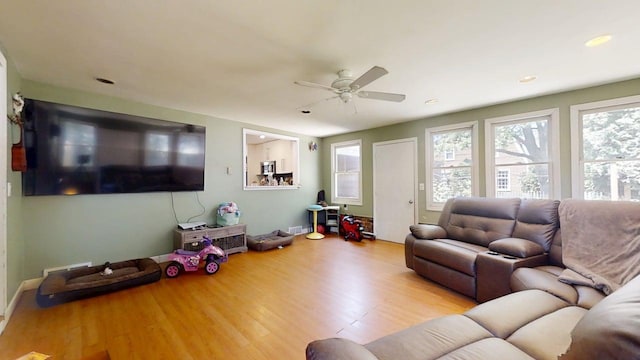 16 W George St, Sullivan, IL 61951 - living room featuring wood finished floors, a ceiling fan, and recessed lighting