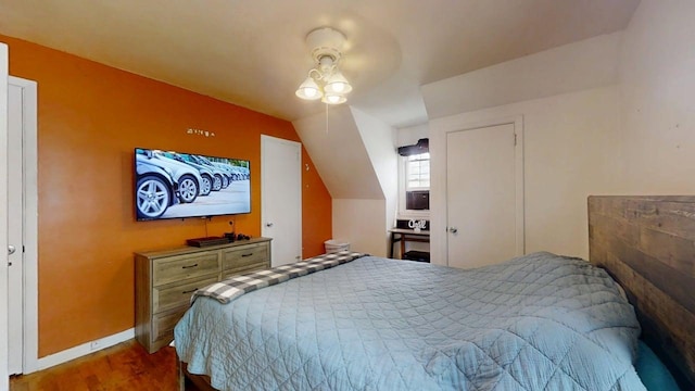 16 W George St, Sullivan, IL 61951 - bedroom featuring wood finished floors and vaulted ceiling