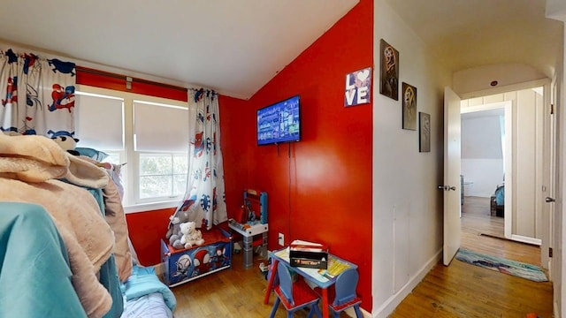 16 W George St, Sullivan, IL 61951 - bedroom with wood finished floors and lofted ceiling