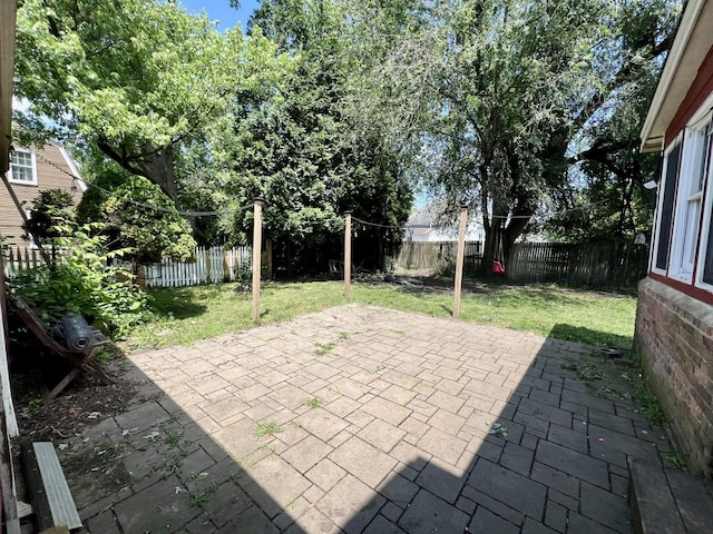 16 W George St, Sullivan, IL 61951 - fenced backyard featuring a patio area