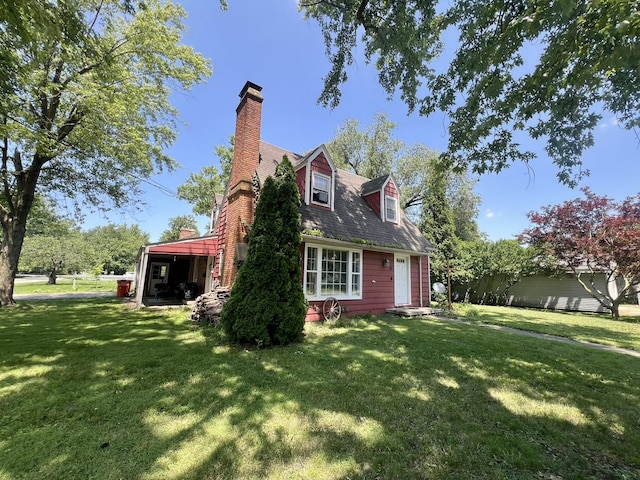 16 W George St, Sullivan, IL 61951 - view of property exterior with a yard and a chimney