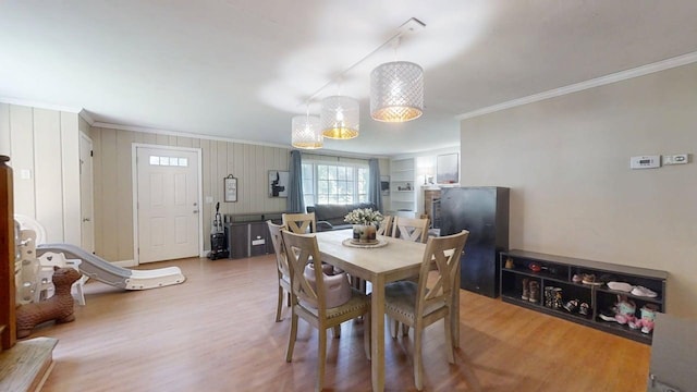 16 W George St, Sullivan, IL 61951 - dining space with ornamental molding and light wood finished floors