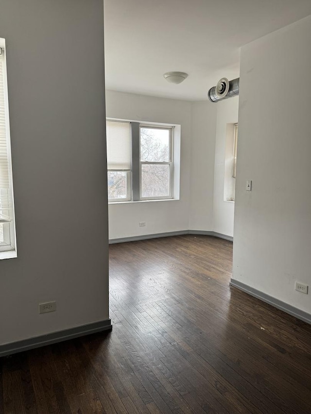 1531 S Kolin Ave, Chicago, IL 60623 - unfurnished room with dark wood finished floors and baseboards