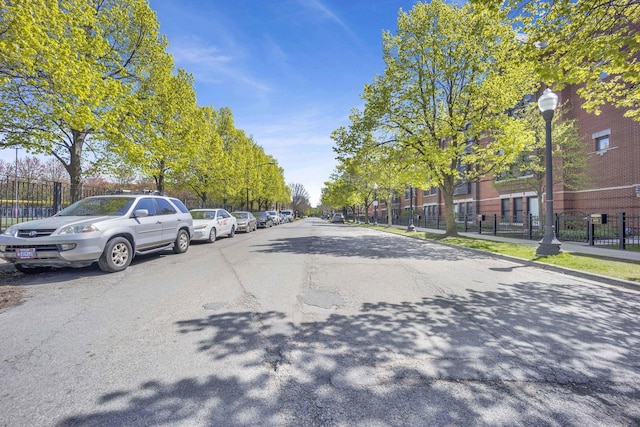 1033 W 14th Pl Unit 337, Chicago, IL 60608 - view of asphalt road featuring street lights and sidewalks