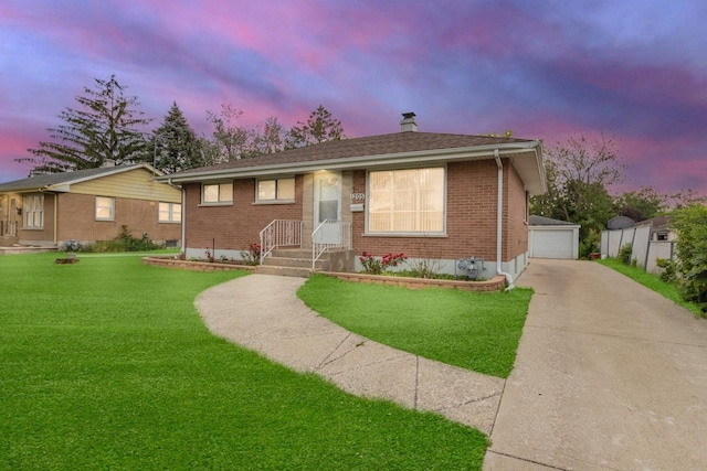 1205 N Irving Ave, Berkeley, IL 60163 - bungalow with brick siding, a front yard, an outdoor structure, and a garage