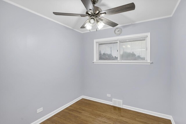 1205 N Irving Ave, Berkeley, IL 60163 - spare room with wood finished floors, ornamental molding, and ceiling fan