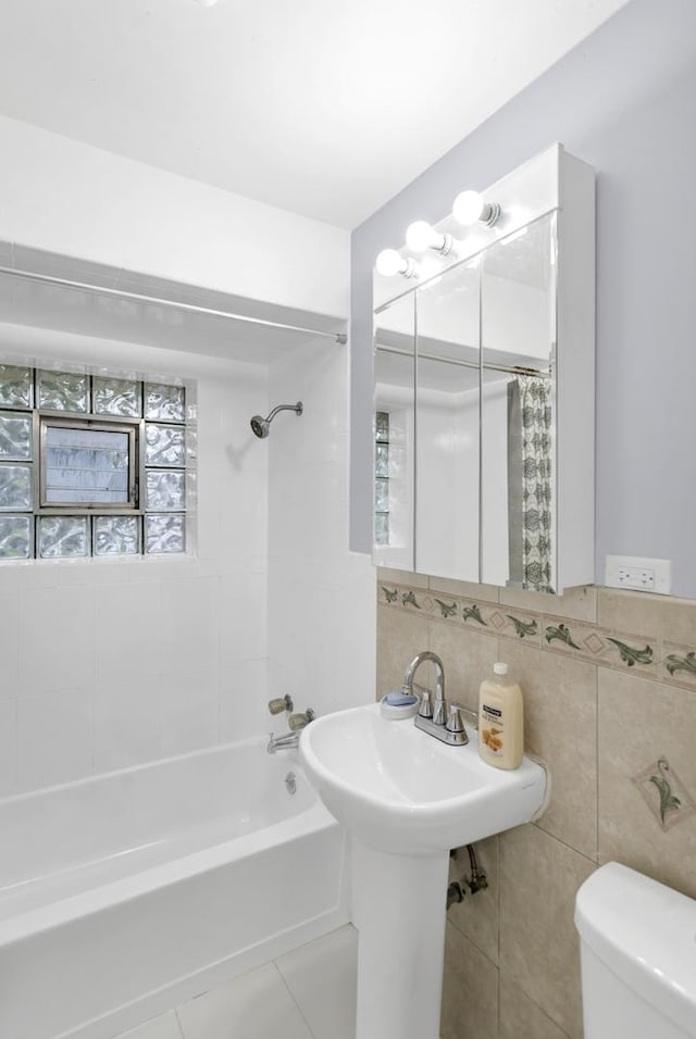 1205 N Irving Ave, Berkeley, IL 60163 - bathroom with tile walls, shower / bath combination with curtain, and decorative backsplash
