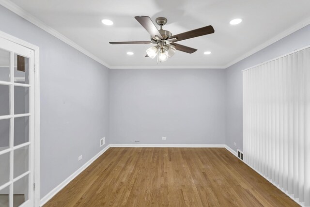 1205 N Irving Ave, Berkeley, IL 60163 - spare room featuring wood finished floors, ceiling fan, recessed lighting, and ornamental molding