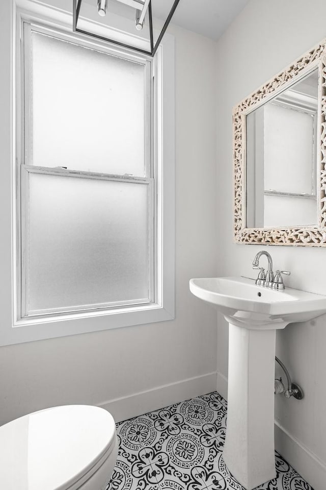 1212 Wesley Ave, Berwyn, IL 60402 - half bath with baseboards and tile patterned floors