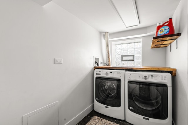 1212 Wesley Ave, Berwyn, IL 60402 - washroom with separate washer and dryer and dark tile patterned flooring
