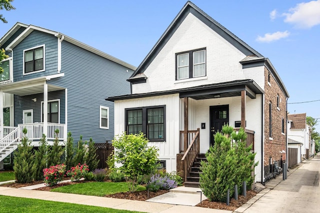 1212 Wesley Ave, Berwyn, IL 60402 - view of front of property with a porch, brick siding, and stairs