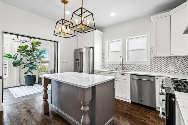 1212 Wesley Ave, Berwyn, IL 60402 - kitchen featuring stainless steel appliances, a chandelier, decorative backsplash, white cabinets, and recessed lighting