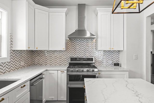1212 Wesley Ave, Berwyn, IL 60402 - kitchen with stainless steel appliances, wall chimney exhaust hood, white cabinetry, and decorative backsplash