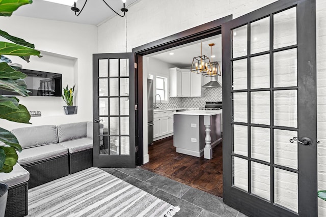 1212 Wesley Ave, Berwyn, IL 60402 - interior space with a chandelier, dark tile patterned floors, and french doors