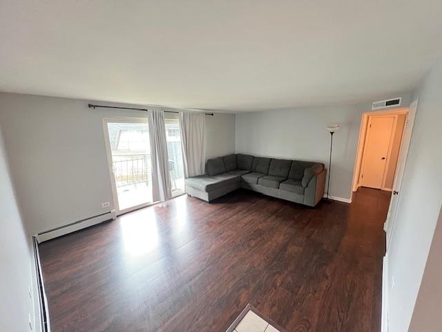 11111 S 84th Ave Unit 3A, Palos Hills, IL 60465 - living area with dark wood-type flooring and a baseboard heating unit