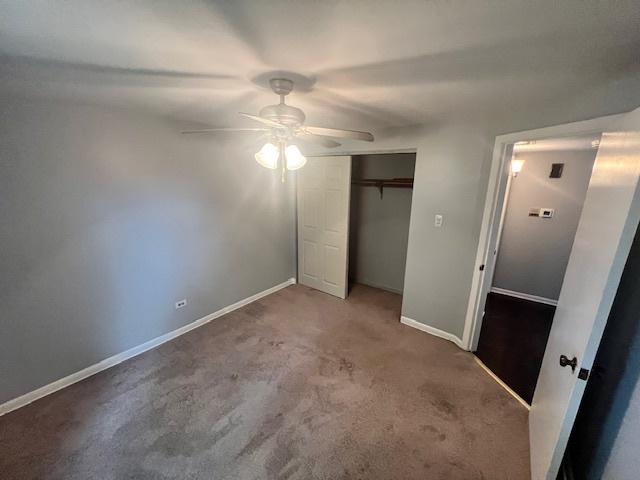 11111 S 84th Ave Unit 3A, Palos Hills, IL 60465 - unfurnished bedroom featuring carpet flooring, a closet, and a ceiling fan