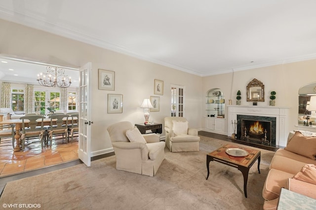 1415 Keystone Ave, River Forest, IL 60305 - living area with crown molding, a chandelier, a fireplace, and french doors
