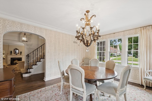 1415 Keystone Ave, River Forest, IL 60305 - dining room with a chandelier, wallpapered walls, wood finished floors, arched walkways, and stairs