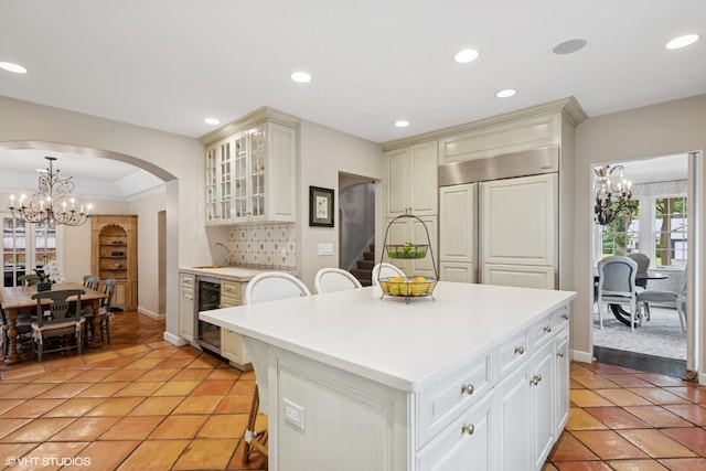 1415 Keystone Ave, River Forest, IL 60305 - kitchen with a chandelier, wine cooler, paneled built in fridge, healthy amount of natural light, and recessed lighting