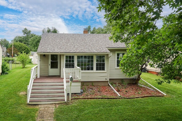 103 S Portland Pl, Clinton, IL 61727 - rear view of property featuring a chimney and roof with shingles