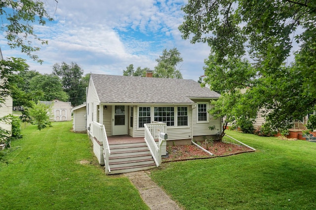103 S Portland Pl, Clinton, IL 61727 - view of front of home featuring a chimney, a front lawn, and a shingled roof