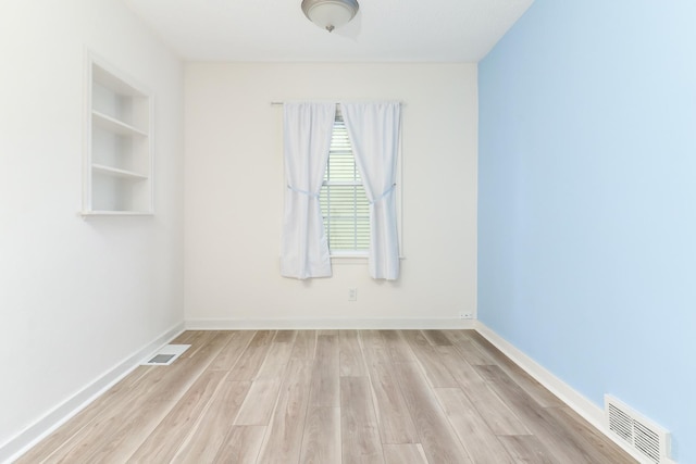103 S Portland Pl, Clinton, IL 61727 - spare room with wood finished floors and baseboards