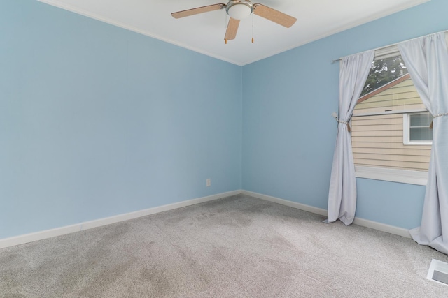 103 S Portland Pl, Clinton, IL 61727 - carpeted empty room with a ceiling fan and crown molding