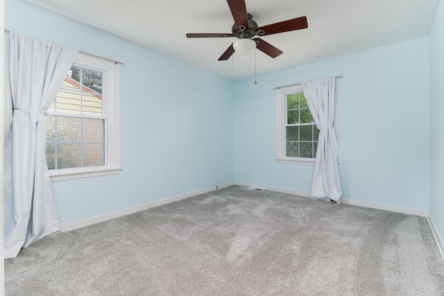 103 S Portland Pl, Clinton, IL 61727 - spare room with carpet flooring and ceiling fan