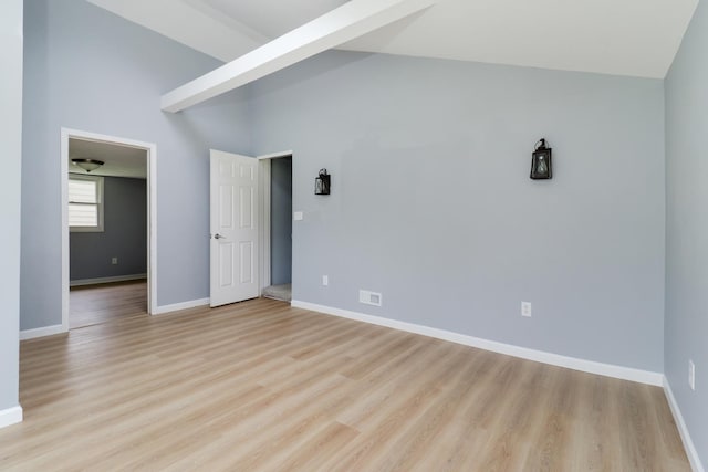 103 S Portland Pl, Clinton, IL 61727 - spare room featuring light wood-style floors and high vaulted ceiling