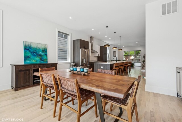 4535 S Evans Ave, Chicago, IL 60653 - dining room with light wood-style flooring and recessed lighting