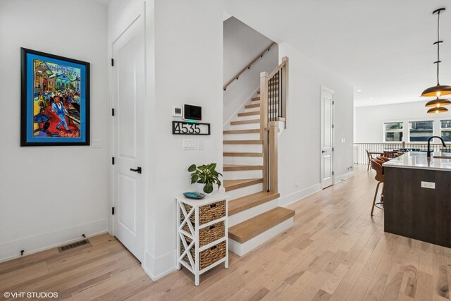 4535 S Evans Ave, Chicago, IL 60653 - stairs featuring wood finished floors and baseboards