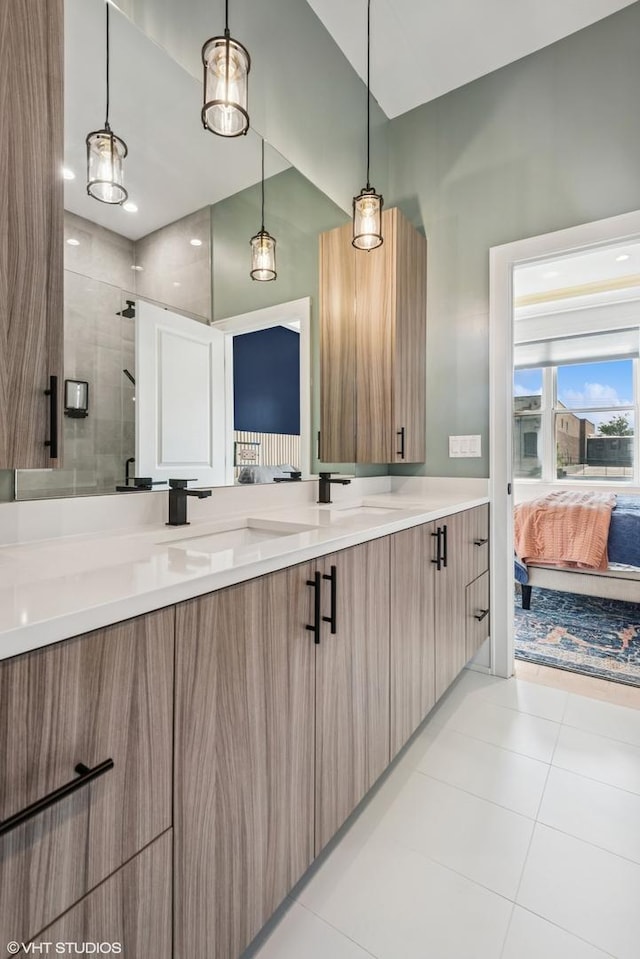 4535 S Evans Ave, Chicago, IL 60653 - ensuite bathroom featuring double vanity, a stall shower, and tile patterned floors