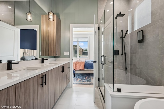 4535 S Evans Ave, Chicago, IL 60653 - ensuite bathroom with double vanity, a shower stall, and tile patterned flooring